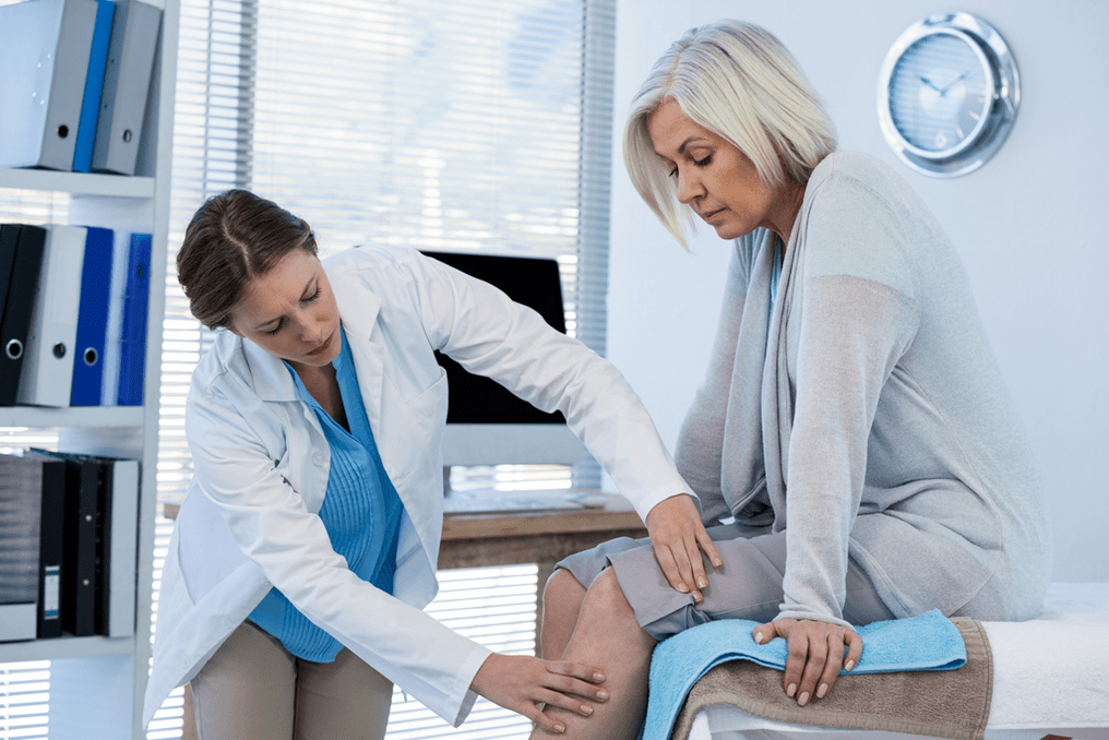 A patient with osteoarthritis who needs therapy is examined by a doctor